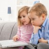 Serious children with laptop